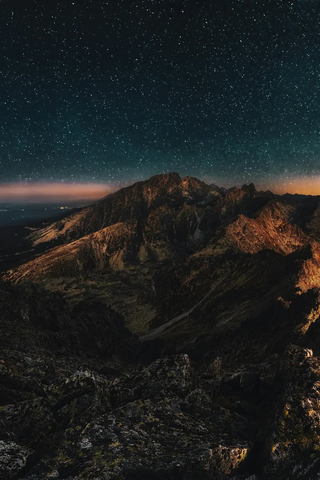 Whispers of the Night: A Celestial Dance Over Majestic Peaks