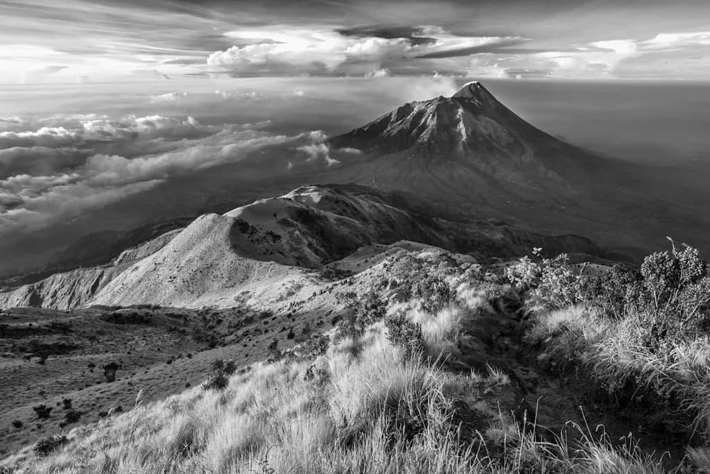 Majestic Shadows: A Black and White Journey Through Mountain Peaks and Clouds