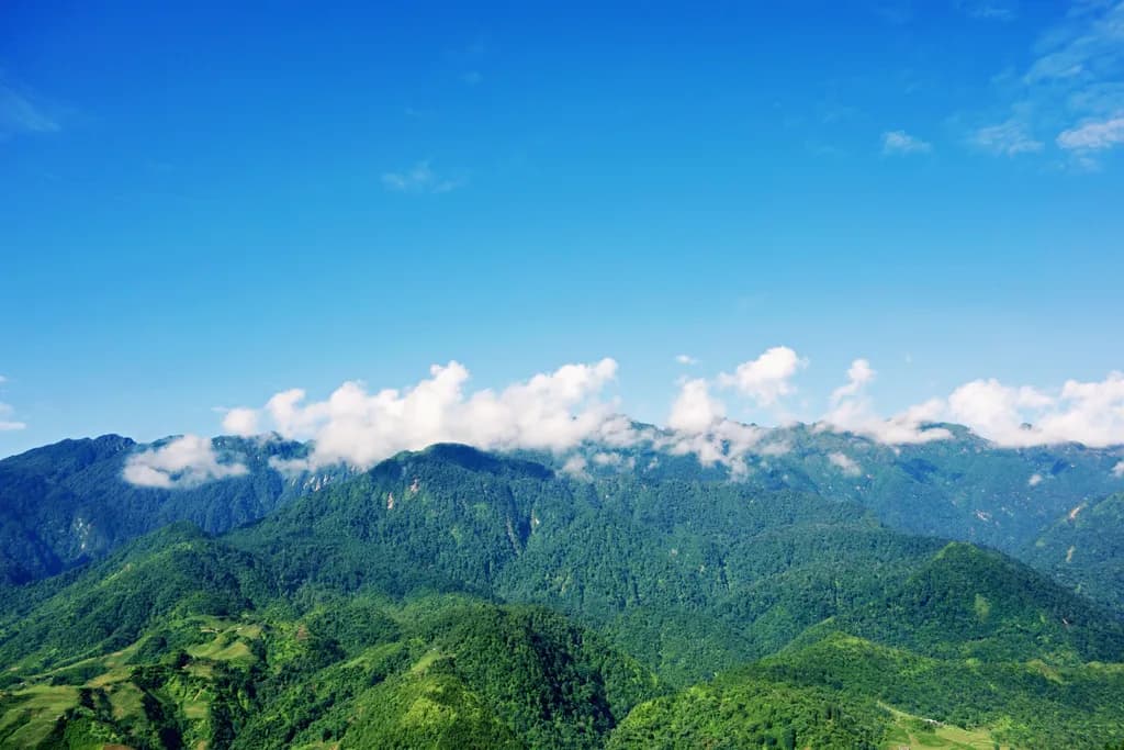 Serenity Above: A Majestic Mountain Landscape Under a Clear Blue Sky
